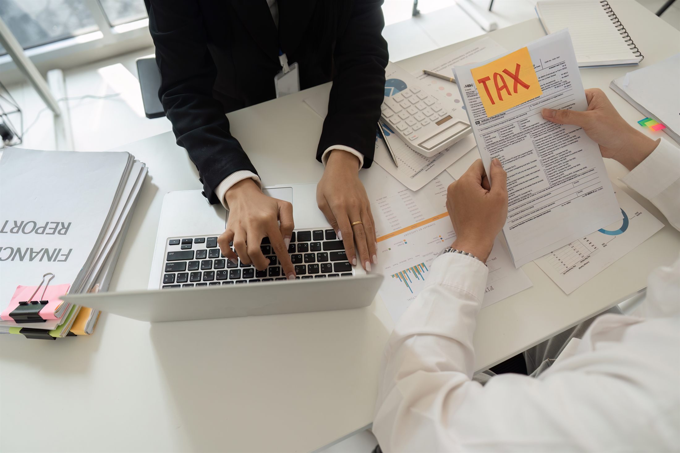 Tax consultant assisting client with financial reports